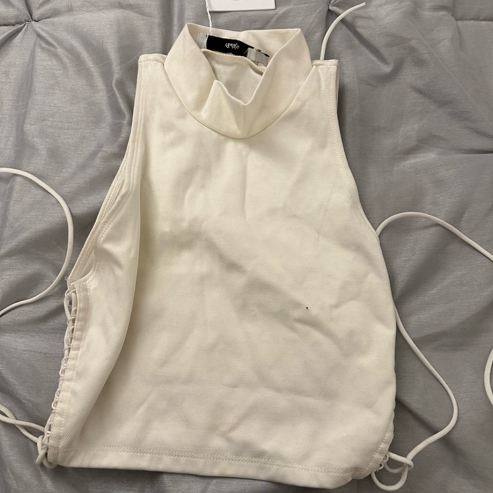 White turtle neck crop top. Tags still on. Never worn.